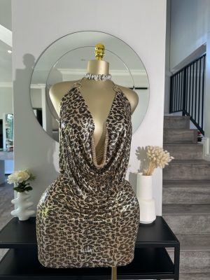 a8797841-a571-4816-85df-3245b20bca10-scaled-1.jpg Snake print open back mini dress